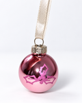 Handmade glossy pink glass Christmas ornament with pink mistletoe design and cream ribbon hanger