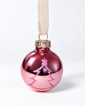 Handmade glossy pink glass Christmas ornament with minimalist pink Christmas tree design and cream ribbon hanger