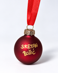 Handmade matte dark red glass Christmas ornament with gold Sretan Božić lettering and red ribbon hanger