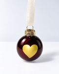 Handmade glossy dark brown glass Christmas ornament with large gold heart and white ribbon hanger